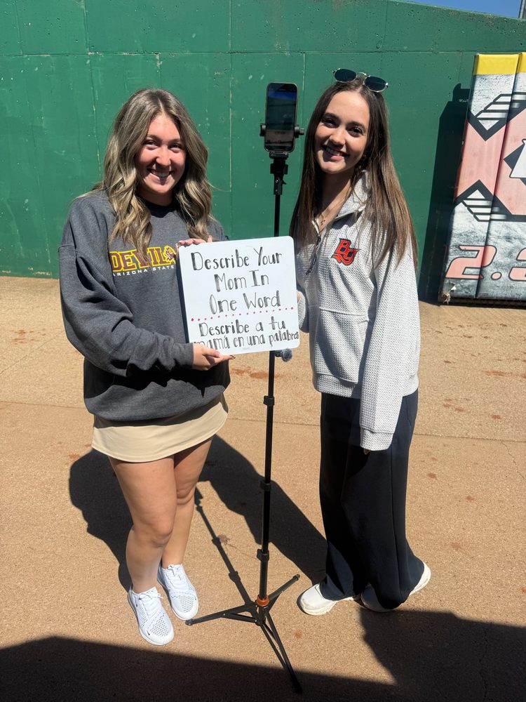 Evelyn filming content on the field