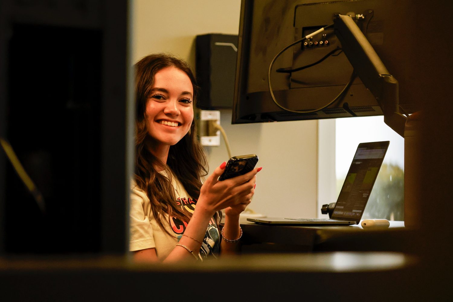 Evelyn editing at her desk